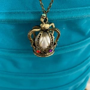 Beautiful crown necklace with long chain.